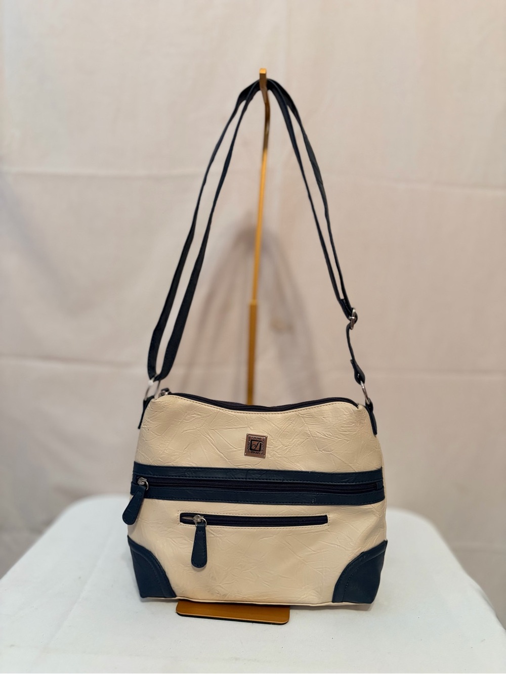 Stone Mountain cream and blue colorblock crossbody bag adjustable strap